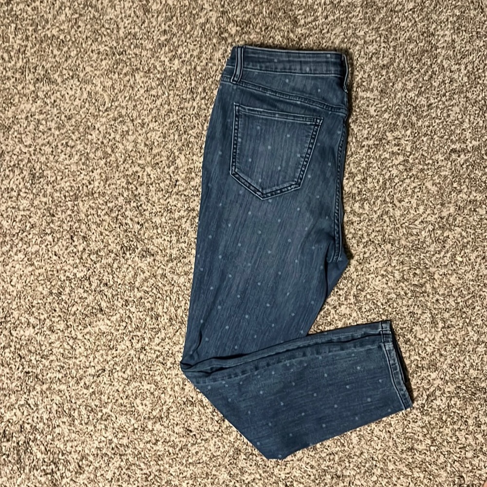 Lighter colored blue jeans with white dots